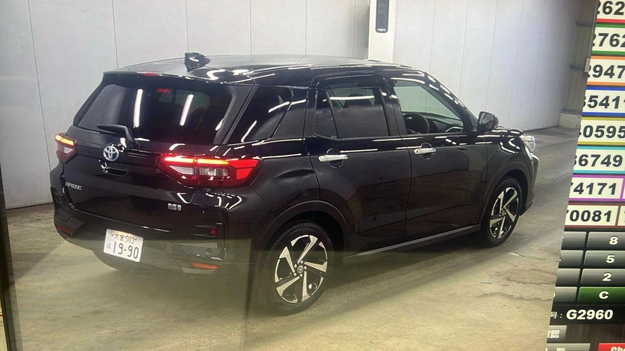 Rear angle of black Toyota Raize Hybrid 2025 with LED lights