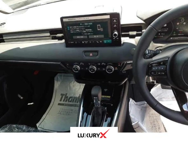 2025 Honda Vezel Pearl White rear view with power tailgate and LED lights