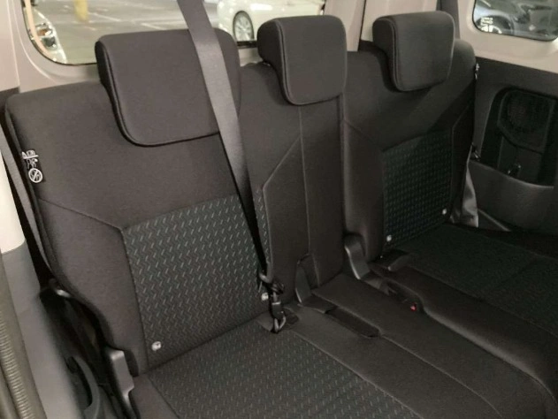 2025 Toyota Roomy mini-van parked in urban setting with sliding door open